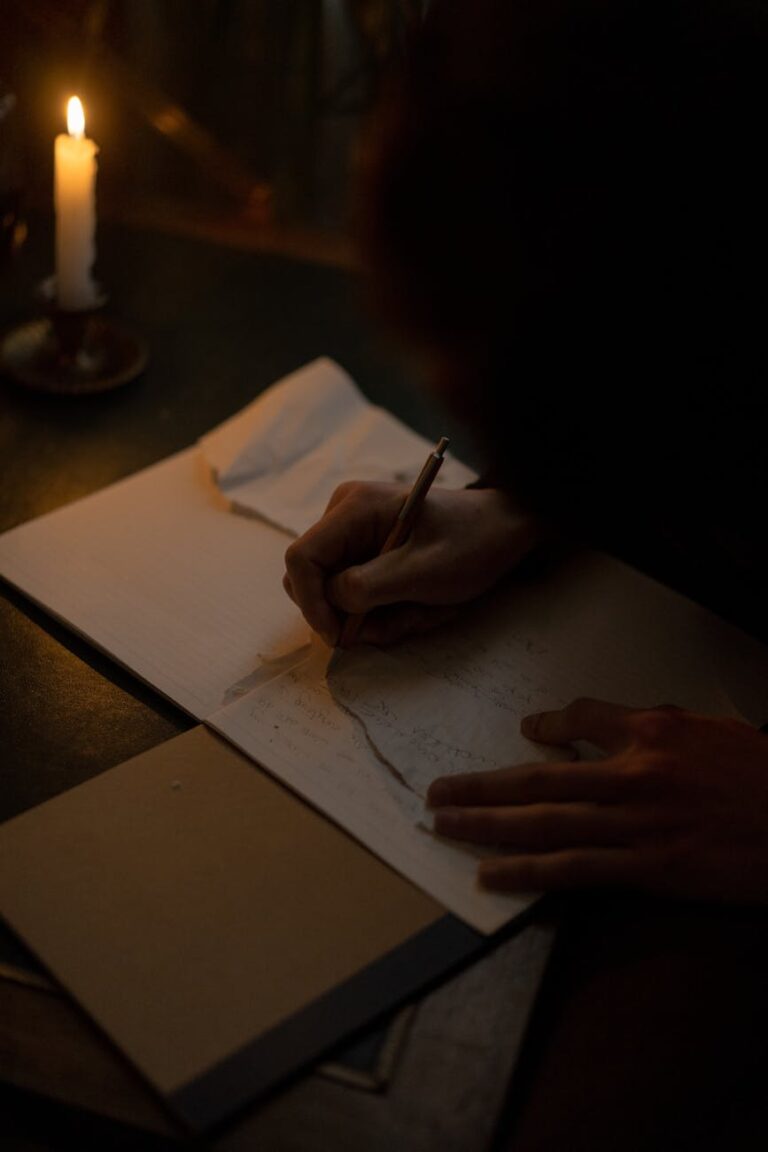 focused person writing on paper